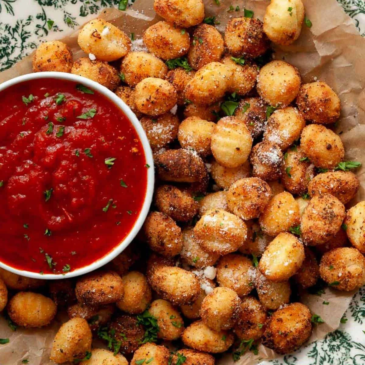 Air Fryer Gnocchi or The easiest and crispiest air fryer gnocchi recipe that takes less than 15 minutes to make. They are crispy on the outside and fluffy on the inside. Use frozen, shelf-stable, or refrigerated potato, cauliflower, and sweet potato gnocchi for an easy appetizer, snack, or side dish. finished