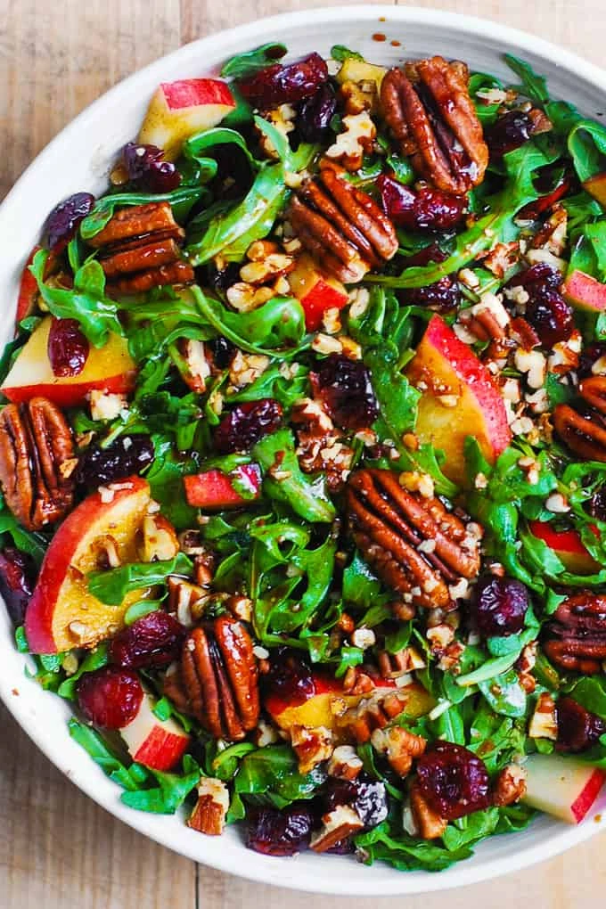 Arugula Salad with Apples, Cranberries, and Pecans with a basic Balsamic dressing finished