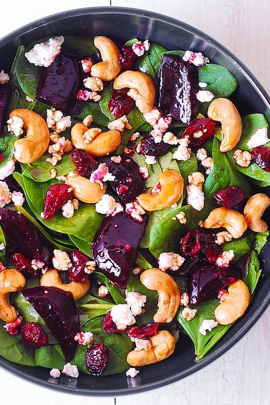Beet Salad with Spinach, Cashews, Cranberries, and Goat Cheese with honey, lemon and olive oil dressing. Something healthy and delicious! to kick off the NEW YEAR! finished