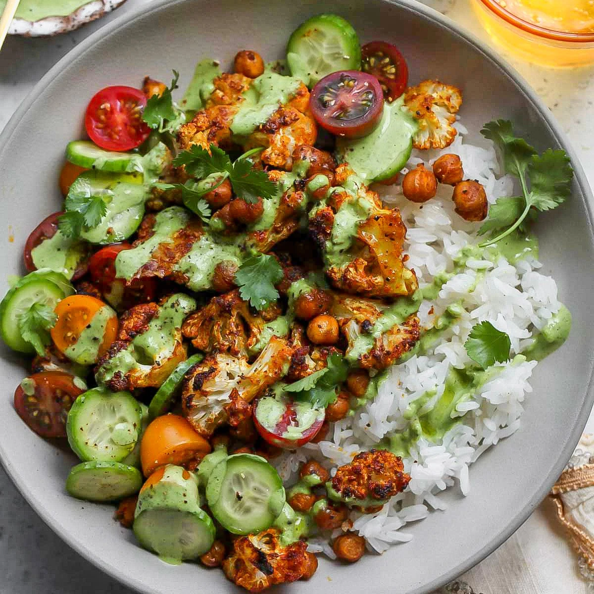 Cauliflower Shawarma Bowls or Cauliflower Shawarma Bowls with crispy chickpeas, basmati rice, and Green Tahini Sauce finished