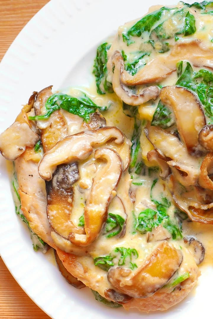 Chicken with Spinach and Mushrooms in creamy Parmesan sauce finished