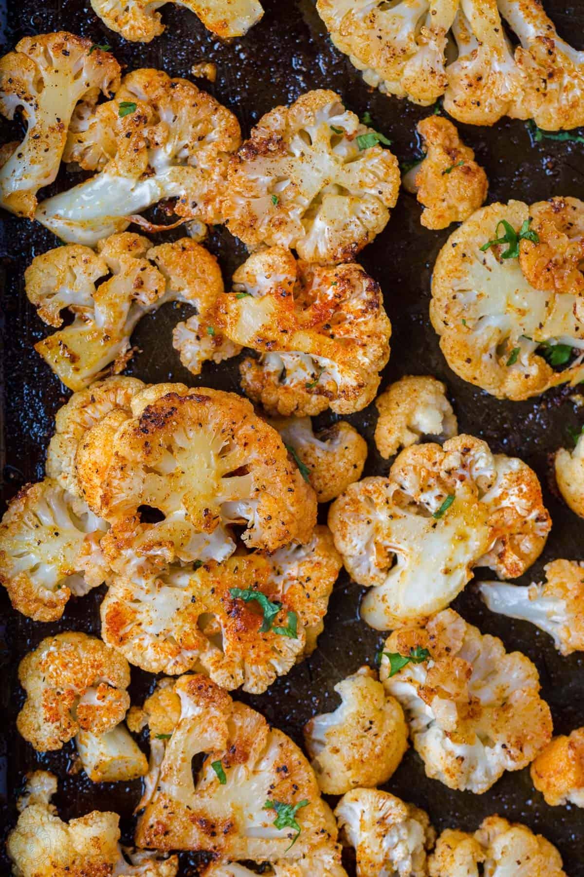 Easy Roasted Cauliflower Recipe or The BEST oven-roasted cauliflower and it is so easy. The flavor and texture are perfect with just some simple seasoning, oil, and butter. It is a dish you will make over and over. This oven-roasted cauliflower is easy and excellent. The combination of butter and olive oil caramelizes the florets and they are baked to crisp-tender perfection. The best thing about this recipe is that you can customize the seasoning with what you have on hand. ingredients