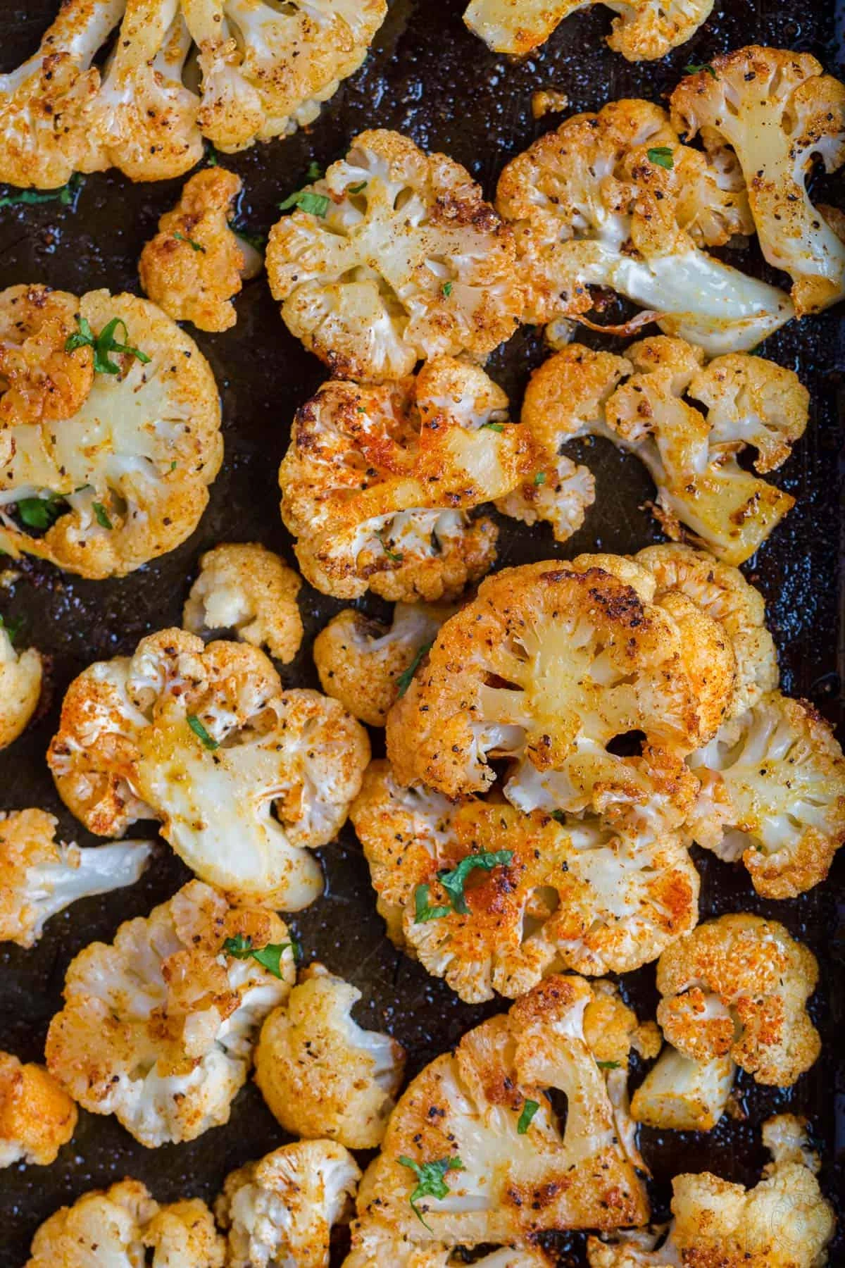 Easy Roasted Cauliflower Recipe or The BEST oven-roasted cauliflower and it is so easy. The flavor and texture are perfect with just some simple seasoning, oil, and butter. It is a dish you will make over and over. This oven-roasted cauliflower is easy and excellent. The combination of butter and olive oil caramelizes the florets and they are baked to crisp-tender perfection. The best thing about this recipe is that you can customize the seasoning with what you have on hand. finished