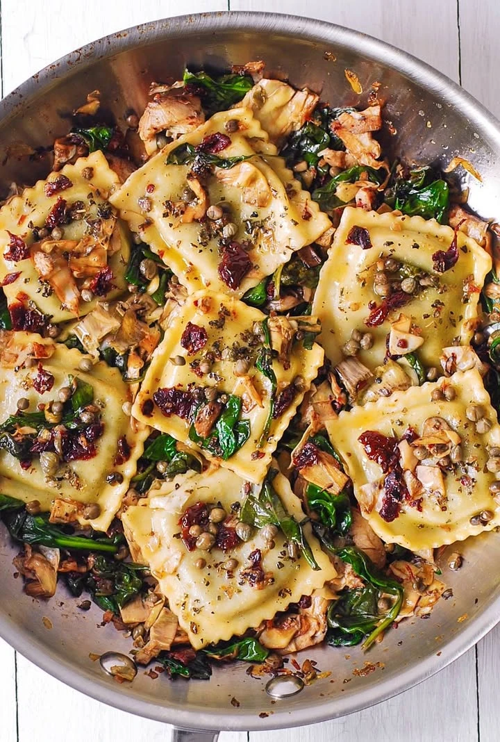Italian Ravioli with Spinach, Artichokes, Capers, and Sun-Dried Tomatoes finished