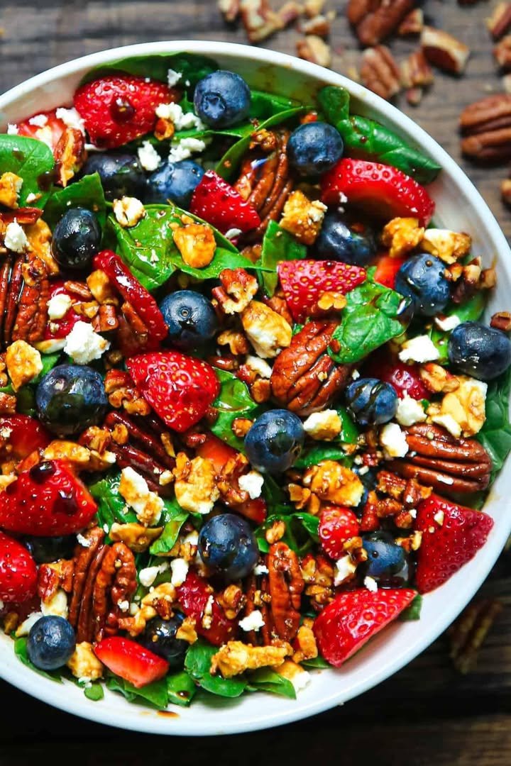 Strawberry Spinach Salad with Blueberries, Pecans, Feta Cheese, and Balsamic glaze. Perfect for EASTER ingredients