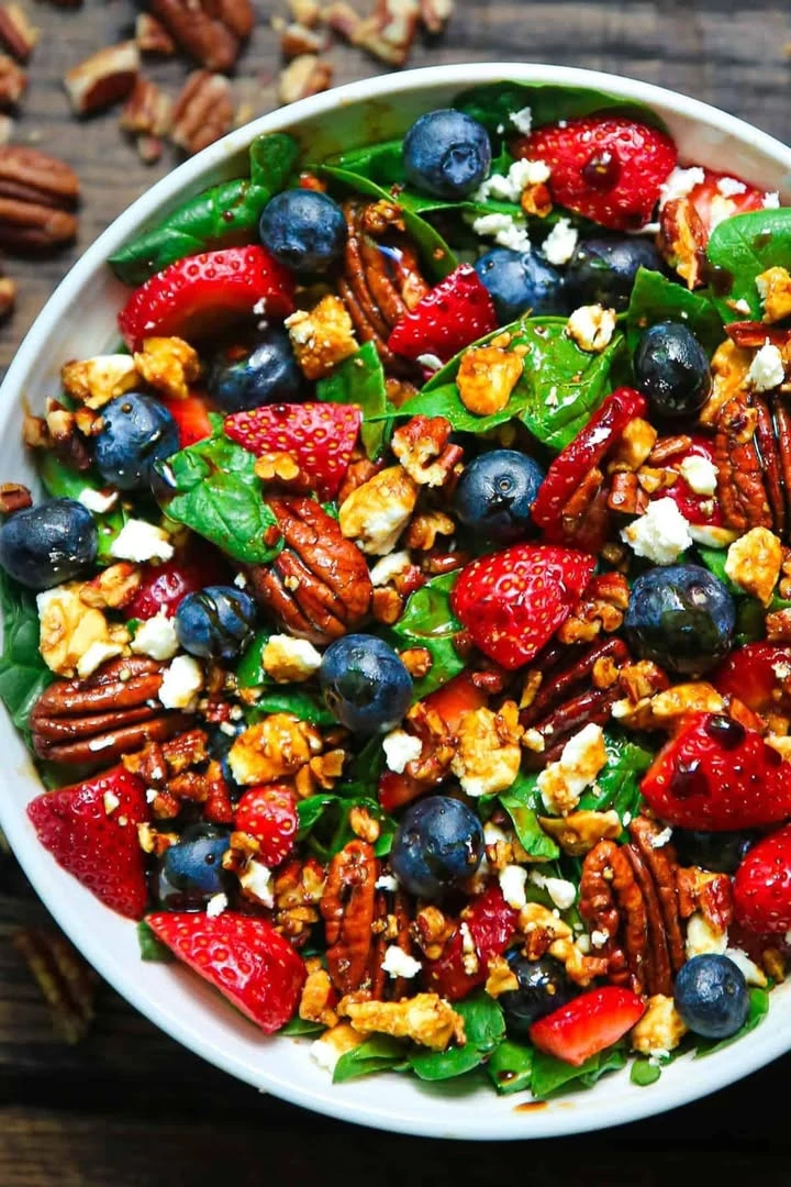 Strawberry Spinach Salad with Blueberries, Pecans, Feta Cheese, and Balsamic glaze. Perfect for EASTER finished